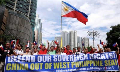 Filipino activists protest against the presence of Chinese vessels in the South China Sea at the Chinese embassy in Makati City the Philippines on April 9 2019