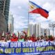 Filipino activists protest against the presence of Chinese vessels in the South China Sea at the Chinese embassy in Makati City the Philippines on April 9 2019