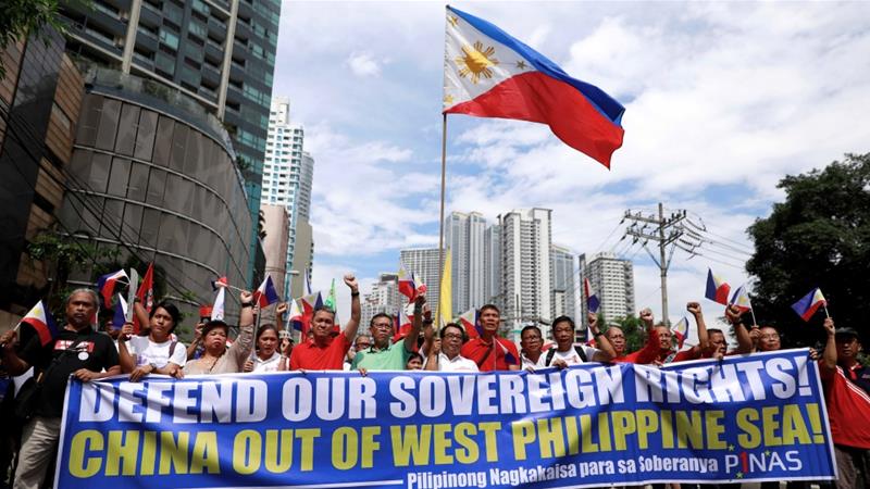 Filipino activists protest against the presence of Chinese vessels in the South China Sea at the Chinese embassy in Makati City the Philippines on April 9 2019