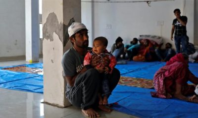 Imran Khan a Muslim man who was injured during during the violence sits with his child at Al Hind hospital Delhi India on Feb 27 2020