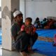 Imran Khan a Muslim man who was injured during during the violence sits with his child at Al Hind hospital Delhi India on Feb 27 2020