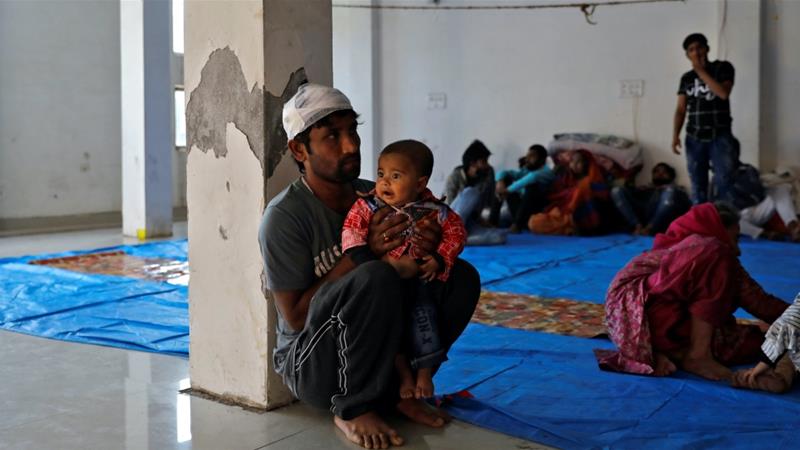 Imran Khan a Muslim man who was injured during during the violence sits with his child at Al Hind hospital Delhi India on Feb 27 2020