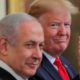 US President Donald Trump waves next to Israeli Prime Minister Benjamin Netanyahu prior to presenting his Middle East plan at the White House on January 28 2020