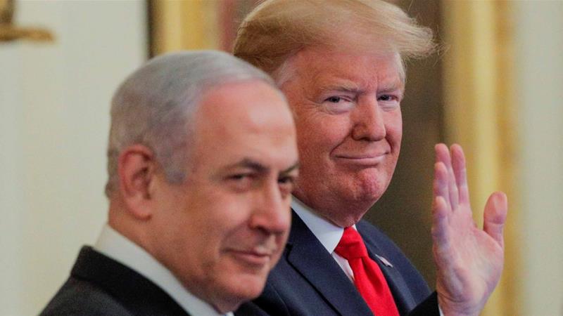 US President Donald Trump waves next to Israeli Prime Minister Benjamin Netanyahu prior to presenting his Middle East plan at the White House on January 28 2020