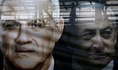 A banner depicts Benny Gantz leader of Blue and White alliance and Israel Prime minister Benjamin Netanyahu in Tel Aviv Israel on February 17 2020
