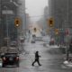 A pedestrian crosses a quiet downtown street as efforts continue to help slow the spread of coronavirus disease in Ottawa Canada on March 23 2020