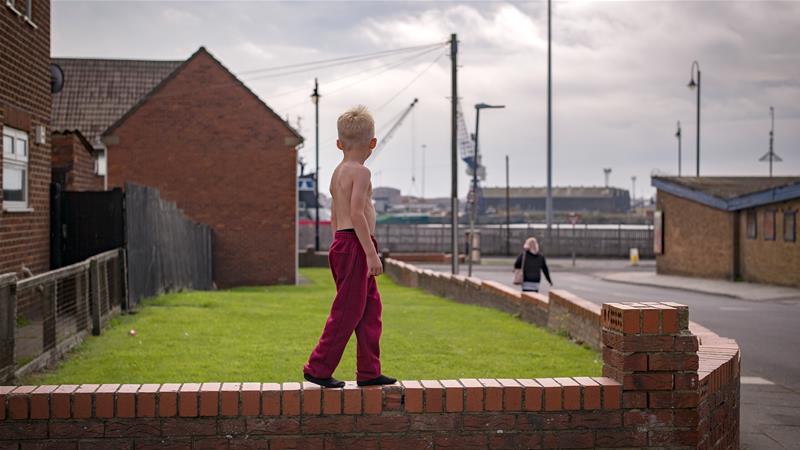 Children play on the street in a town in the north east of England which has some of the worst levels of economic deprivation in the UK