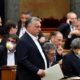 Hungarian Prime Minister Viktor Orban arrives in parliament ahead of a vote on a special law to combat the coronavirus crisis in Budapest Hungary on March 30 2020