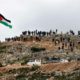 Palestinian demonstrators gather on a hilltop during a protest against Israeli settlements in the town of Beita in the occupied West Bank on March 2 2020