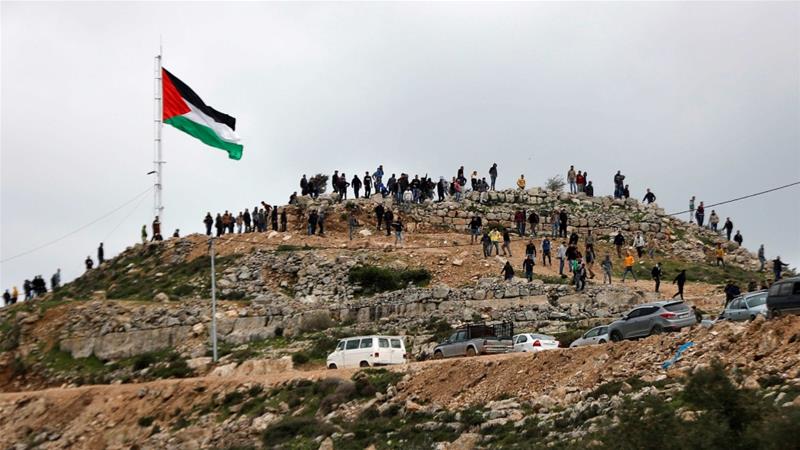 Palestinian demonstrators gather on a hilltop during a protest against Israeli settlements in the town of Beita in the occupied West Bank on March 2 2020