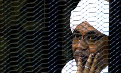 Sudans former president Omar Hassan al Bashir sits inside a cage at the courthouse where he is facing corruption charges in Khartoum on September 28 2019