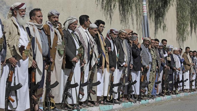 Tribesmen loyal to Houthi rebels hold their weapons during a gathering aimed at mobilising more fighters for the Houthi movement in Sanaa Yemen on February 25 2020
