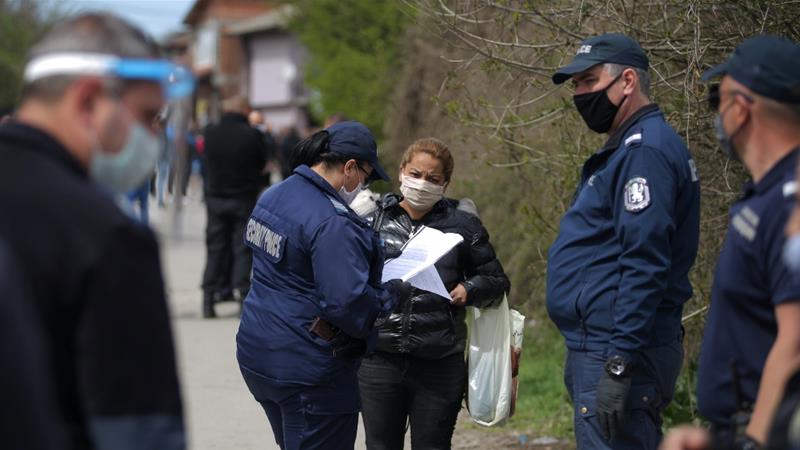 A policewoman checks the papers of a woman at the biggest Roma populated district amid the COVID 19 outbreak in Sofia Bulgaria April 17 2020