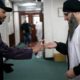 A volunteer dispenses hand sanitiser to devotees attending Friday prayers at Birmingham Central Mosque on March 13 2020 in Birmingham England