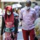 An African couple wearing masks walk in the African Village part of Guangzhou Guangdong province China on 29 April 2020