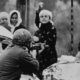 An Israeli soldier aims his rifle at a Palestinian woman holding a rock during a demonstration in which one Palestinian youth was shot dead in Gaza on February 29 1988