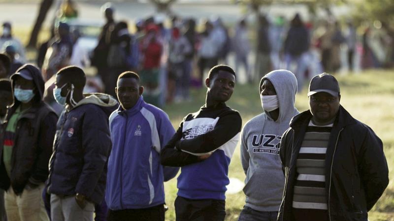 Informal traders stand in a queue as they wait to apply for a permit amid a nationwide COVID 19 lockdown in Soweto South Africa April 23 2020