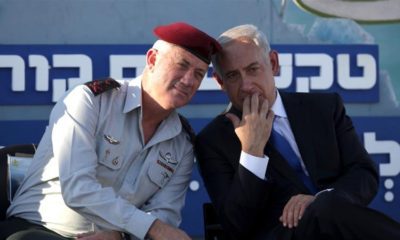 Israeli Prime Minister Benjamin Netanyahu speaks with Israeli Chief of Staff Lt Gen Benny Gantz during a graduation ceremony of navy officers in Haifa on September 11 2013