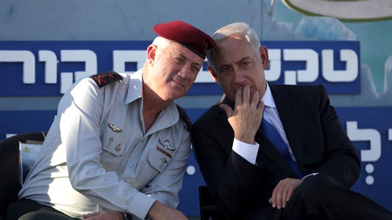 Israeli Prime Minister Benjamin Netanyahu speaks with Israeli Chief of Staff Lt Gen Benny Gantz during a graduation ceremony of navy officers in Haifa on September 11 2013