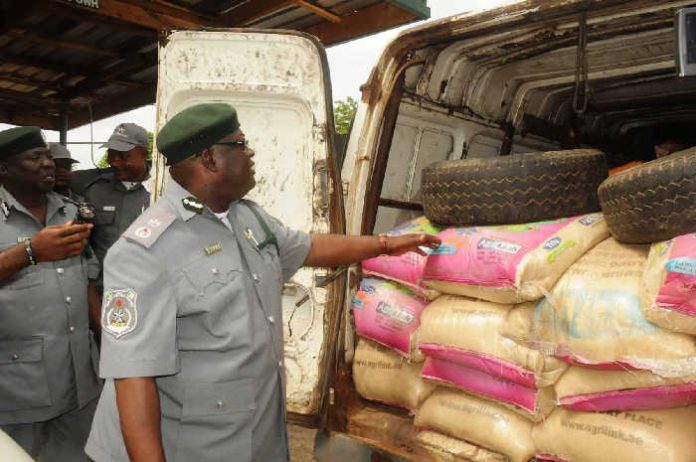 Nigeria Customs and their seized rice