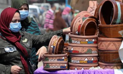 Women shop at a market wearing protective face masks amid concerns over COVID 19 in Cairo Egypt on April 12 2020