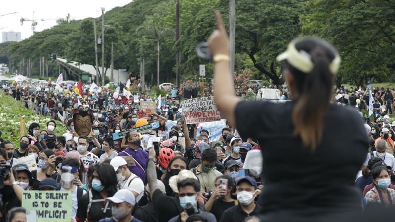 A protester talks to the crowd during a rally against the proposed anti terror bill at the University of the Philippines in Manila Philippines on June 12 2020