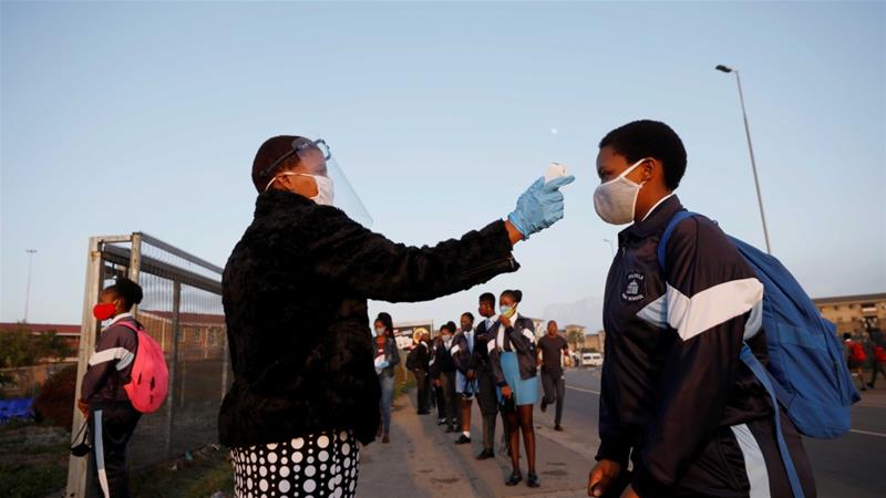 A student is screened as schools begin to reopen amid the coronavirus outbreak in Langa township in Cape Town South Africa on June 8 2020