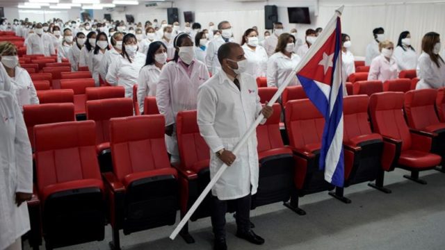 Cuban doctors attend a farewell ceremony before departing to Kuwait to assist the countrys ongoing fight against COVID 19 Havana Cuba on June 4 2020