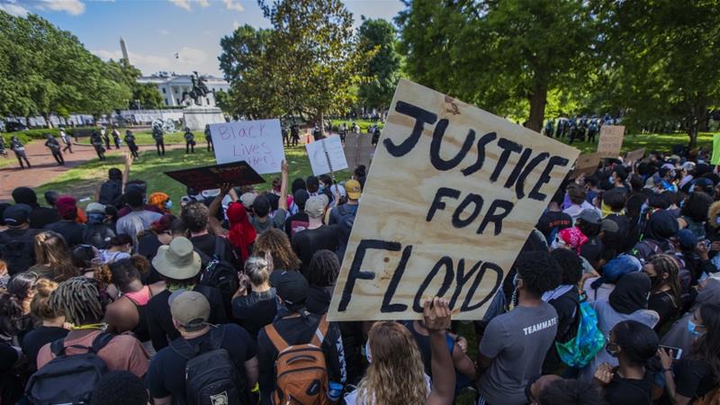 Demonstrators rally at Lafyette Park near the White House in Washington on May 31 2020 protesting the death of George Floyd a black man who died in police custody