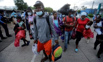 Migrants who are stranded in Honduras after borders were closed due to the pandemic are seen as they board a bus going to a shelter in Tegucigalpa Honduras on June 3 2020