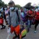Migrants who are stranded in Honduras after borders were closed due to the pandemic are seen as they board a bus going to a shelter in Tegucigalpa Honduras on June 3 2020