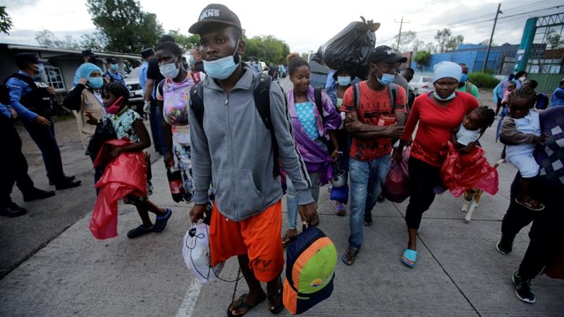 Migrants who are stranded in Honduras after borders were closed due to the pandemic are seen as they board a bus going to a shelter in Tegucigalpa Honduras on June 3 2020