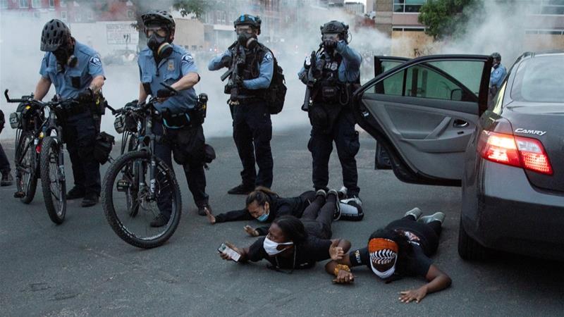 Minneapolis police department officers detain people during demonstrations over the death of George Floyd in police custody. Picture taken on May 31 2020