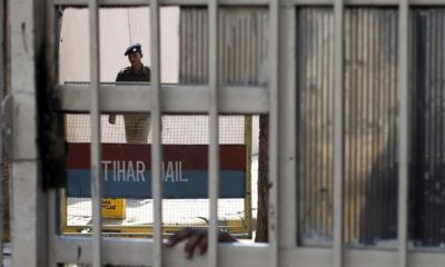A policeman walks inside the Tihar Jail in New Delhi on March 11 2013