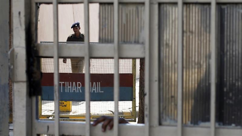 A policeman walks inside the Tihar Jail in New Delhi on March 11 2013