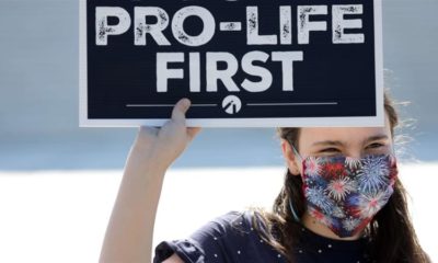 A pro life activist holds a sign during a demonstration in front of the US Supreme Court on June 29 2020 in Washington DC