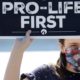 A pro life activist holds a sign during a demonstration in front of the US Supreme Court on June 29 2020 in Washington DC