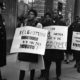 Pickets carrying anti Belgian and pro Lumumba placards parade near the Belgian consulate in New York on February 11 1961