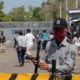A prison guard stands at the entrance of La Modelo after 2500 prisoners were released due to coronavirus concerns in Nicaragua