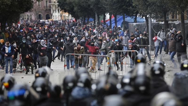 Anti government protesters clash with riot police in downtown Beirut Lebanon on February 11 2020