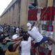 Protesters try to remove a concrete barrier to open a road leading to the parliament building during an anti government protest in Beirut Lebanon on August 10 2020