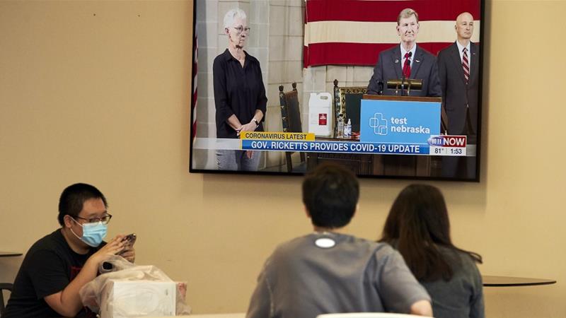 University of Nebraska Lincoln students watch a tv report on the university administrations plans to resume in person classes in the fall amid the pandemic on July 21 2020