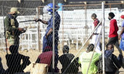 Zimbabwean police and army roundup people at a checkpoint in the countrys capital Harare ahead of planned anti government protests July 30 2020