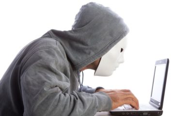 man with mask and hood using computer internet security concept 471242201 57d558a75f9b589b0a19e9ec