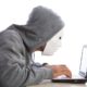 man with mask and hood using computer internet security concept 471242201 57d558a75f9b589b0a19e9ec