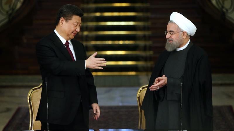 Chinas President Xi Jinping left and his Iranian counterpart Hassan Rouhani are seen together following a joint press conference in Tehran Iran January 23 2016