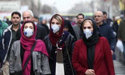 Iranian women wearing protective masks to protect themselves from the coronavirus walk at the Grand Bazaar in Tehran on February 20 2020