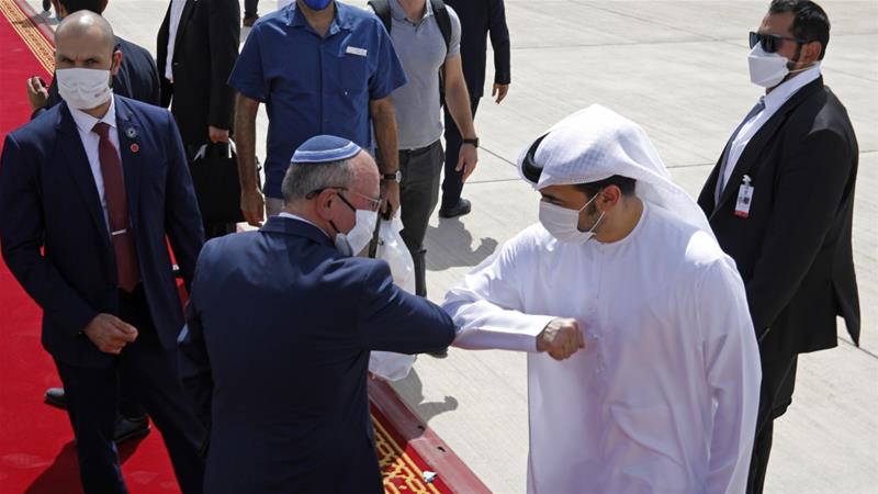 Israeli National Security Adviser Meir Ben Shabbat elbow bumps with an Emirati official as he leaves Abu Dhabi on September 1 2020