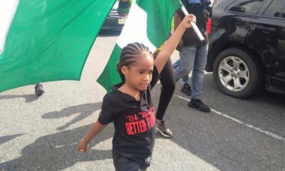 A young Nigerian girl matching End SARS