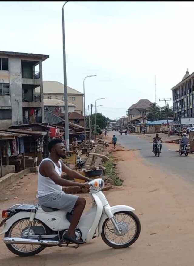 Young man in a motor bike